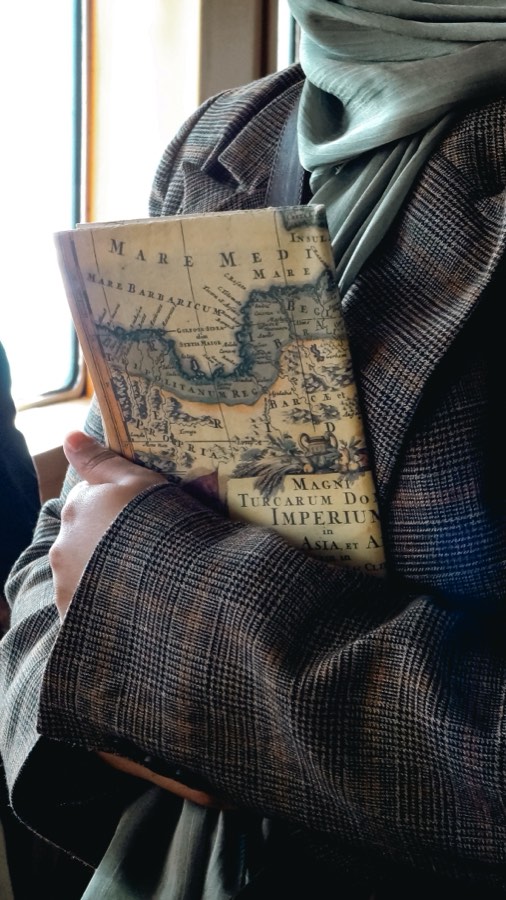 Explorer holding an antique map